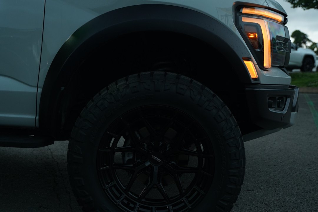 Vossen wheel and all-terrain tire on lifted Ford F-150 Raptor, Titan Motoring