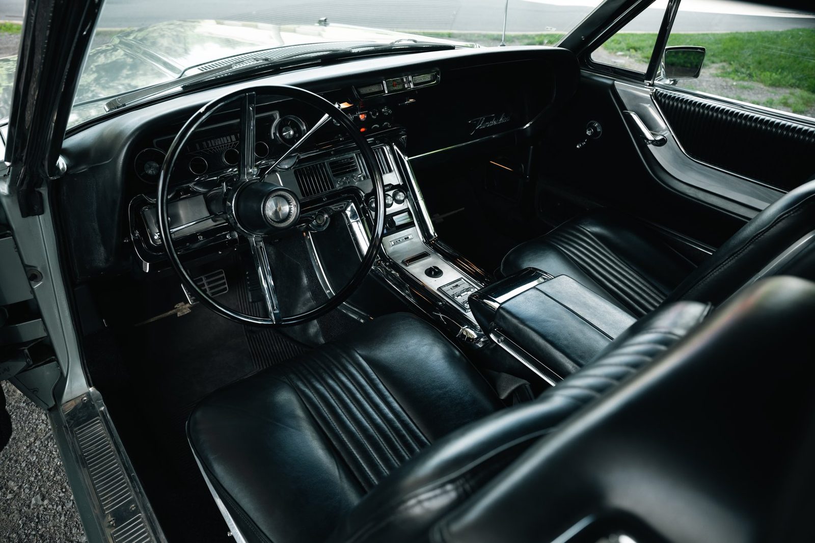 Restored interior of a 1964 Ford Thunderbird with retrofitted gauges