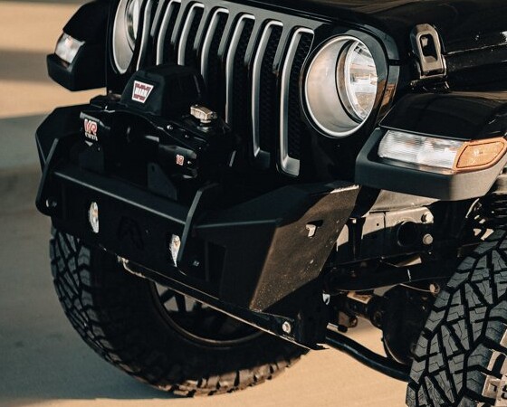 Warn VR EVO 10 winch mounted in a Fab Fours stubby bumper on a Jeep Wrangler JL