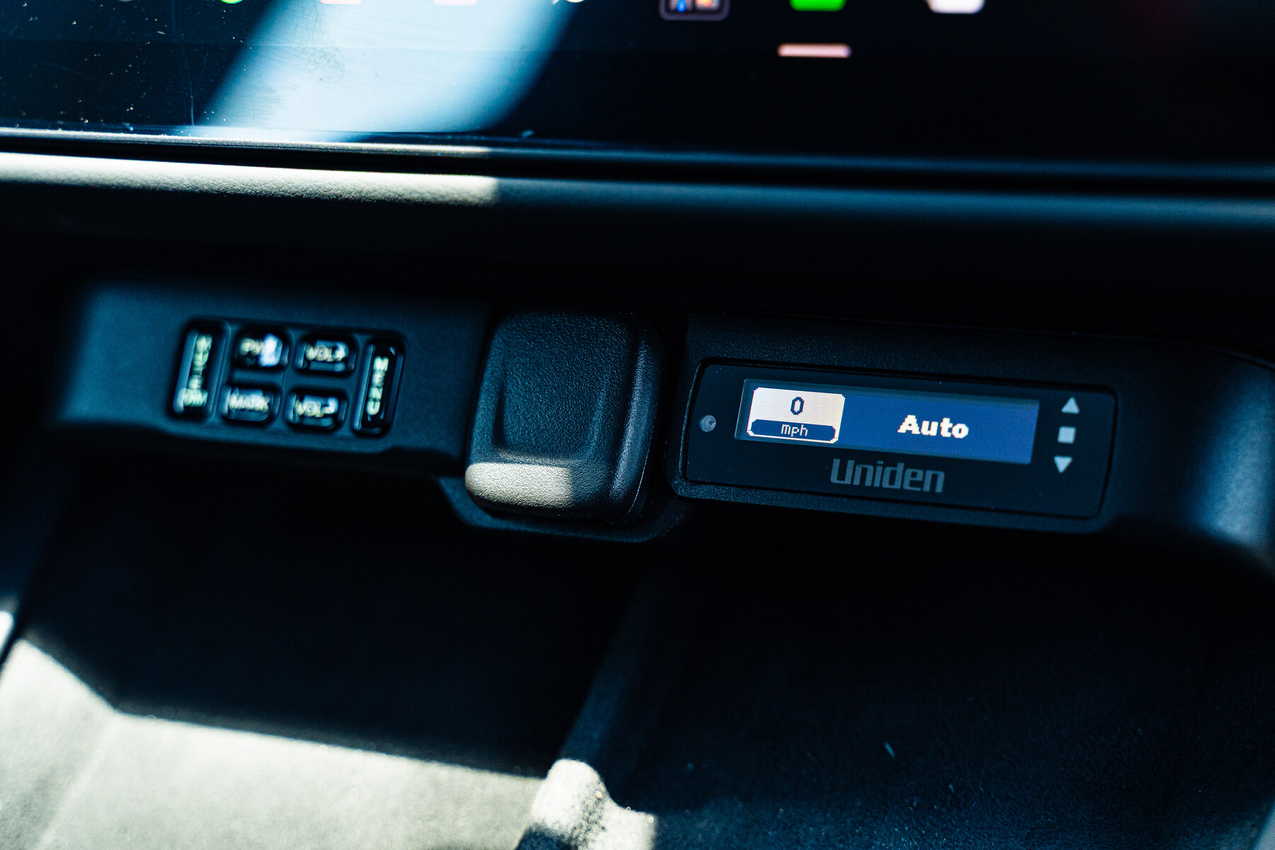 Uniden R9W display and control pad flush-mounted into the factory dash paneling of a Tesla Model S Plaid