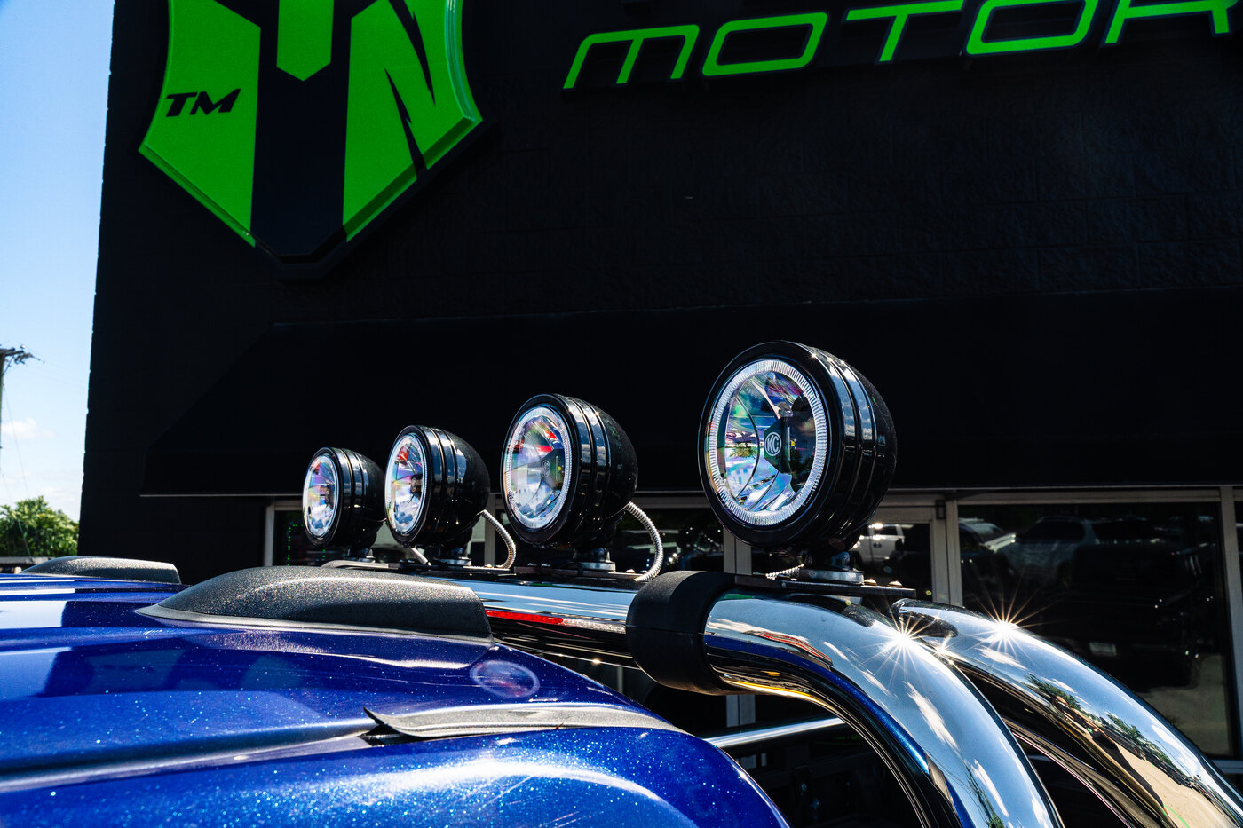 Omac polished stainless bed roll bar with two pairs of KC Hilites 6 inch Daylighter LEDs on a Ford F-150