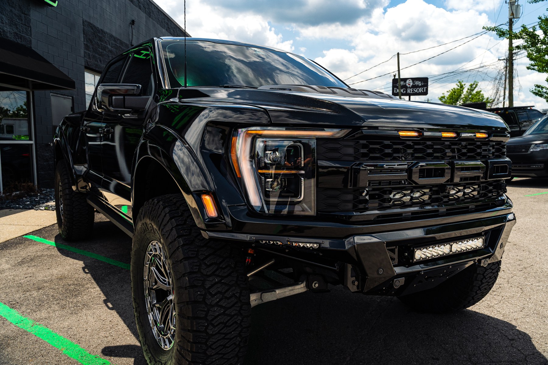 Front three-quarter view of a Ford Raptor R with ADD Phantom bumper and grille light package at Titan Motoring Nashville