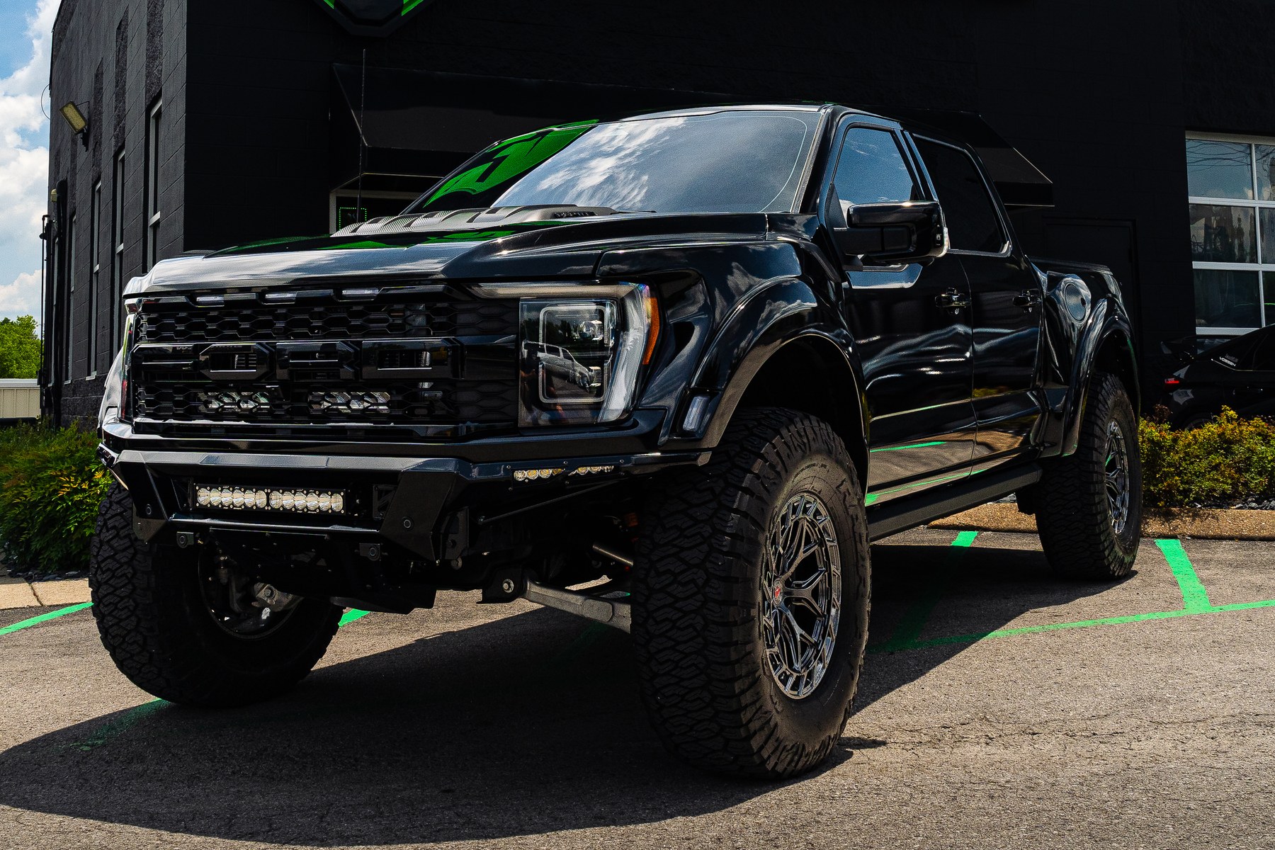 Ford F-150 Raptor R wrapped in KPMF Gloss Phantom Black Metallic over Fiberwerx widebody fenders