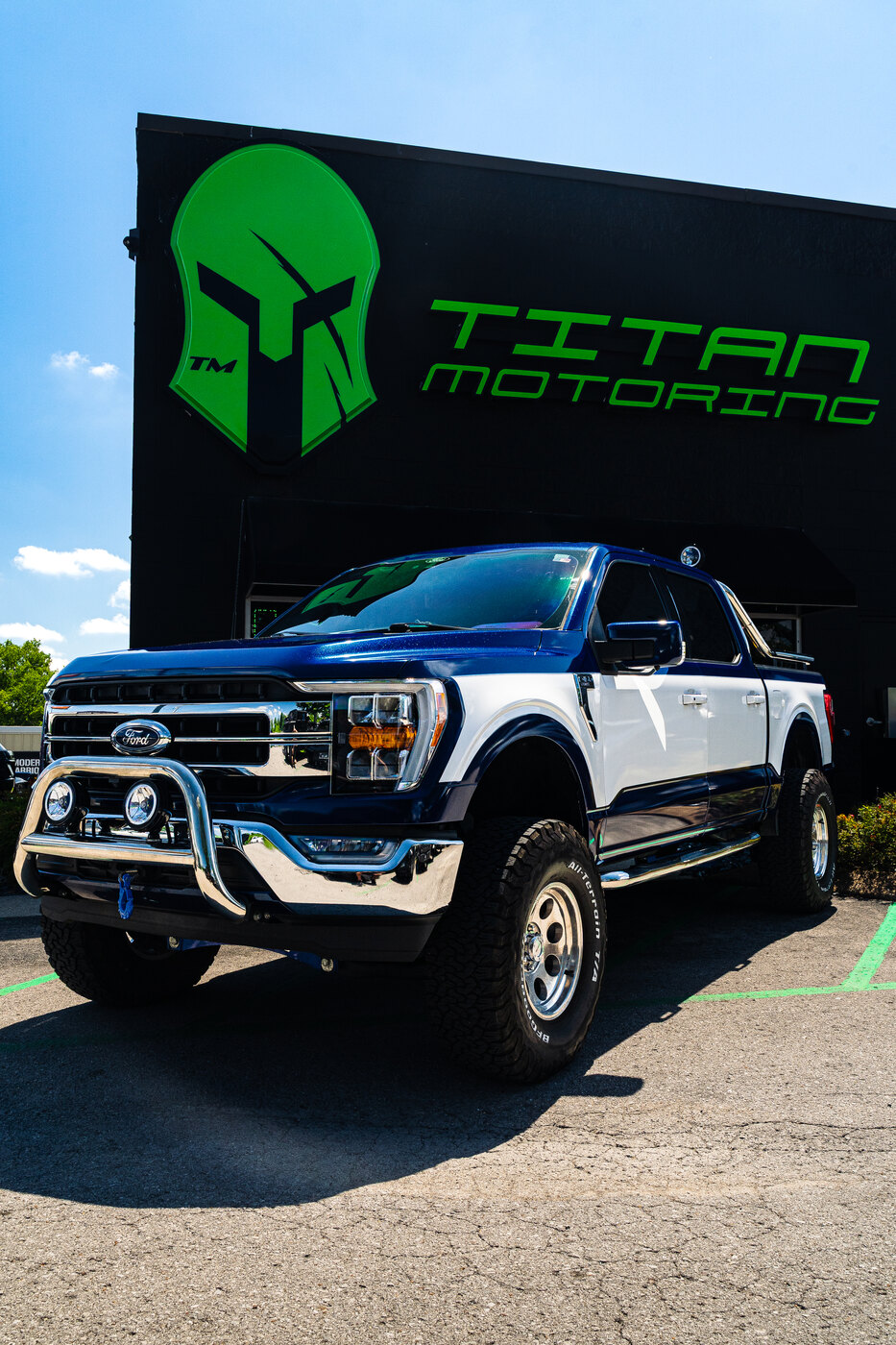 Chrome bull bar with KC Hilites light pods on a lifted Ford F-150 Lariat