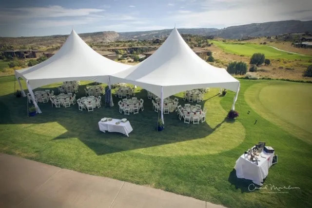Outdoor wedding setup at Redlands Mesa Golf Course with Colorado National Monument backdrop