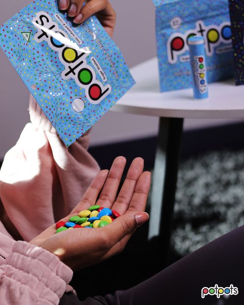 Person pouring potpots edibles from the bag into their hand