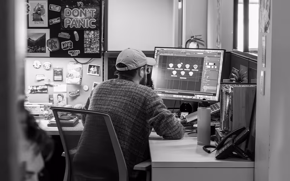 man working at a computer in Lawrence & Schiller advertising agency