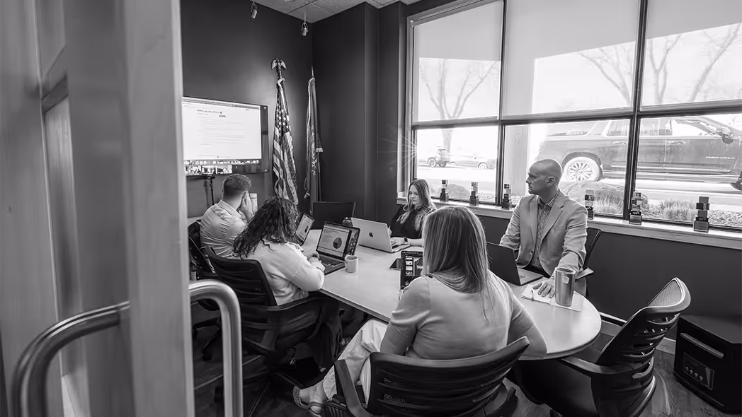 team of L&Sers in a meeting together