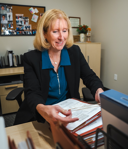 Bassford Remele attorney doing paperwork | Lawrence & Schiller Creative Case Studies - Bassford Remele