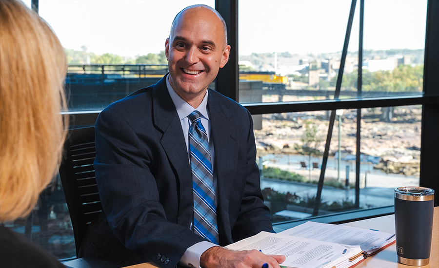 Bassford Remele attorney in a meeting | Lawrence & Schiller Creative Case Studies - Bassford Remele