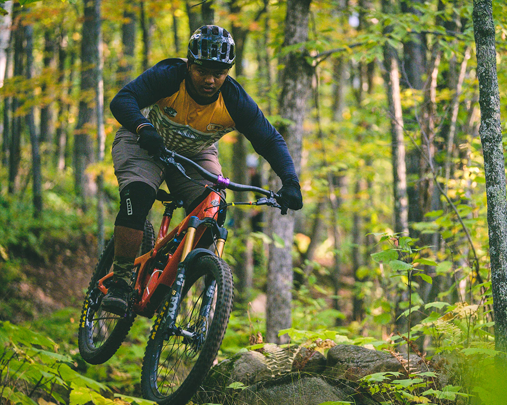 man riding a bike through forests | Lawrence & Schiller Creative Case Studies - Visit Duluth, City of Duluth