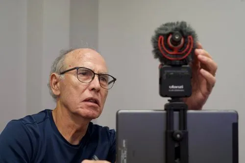 Man adjusts microphone