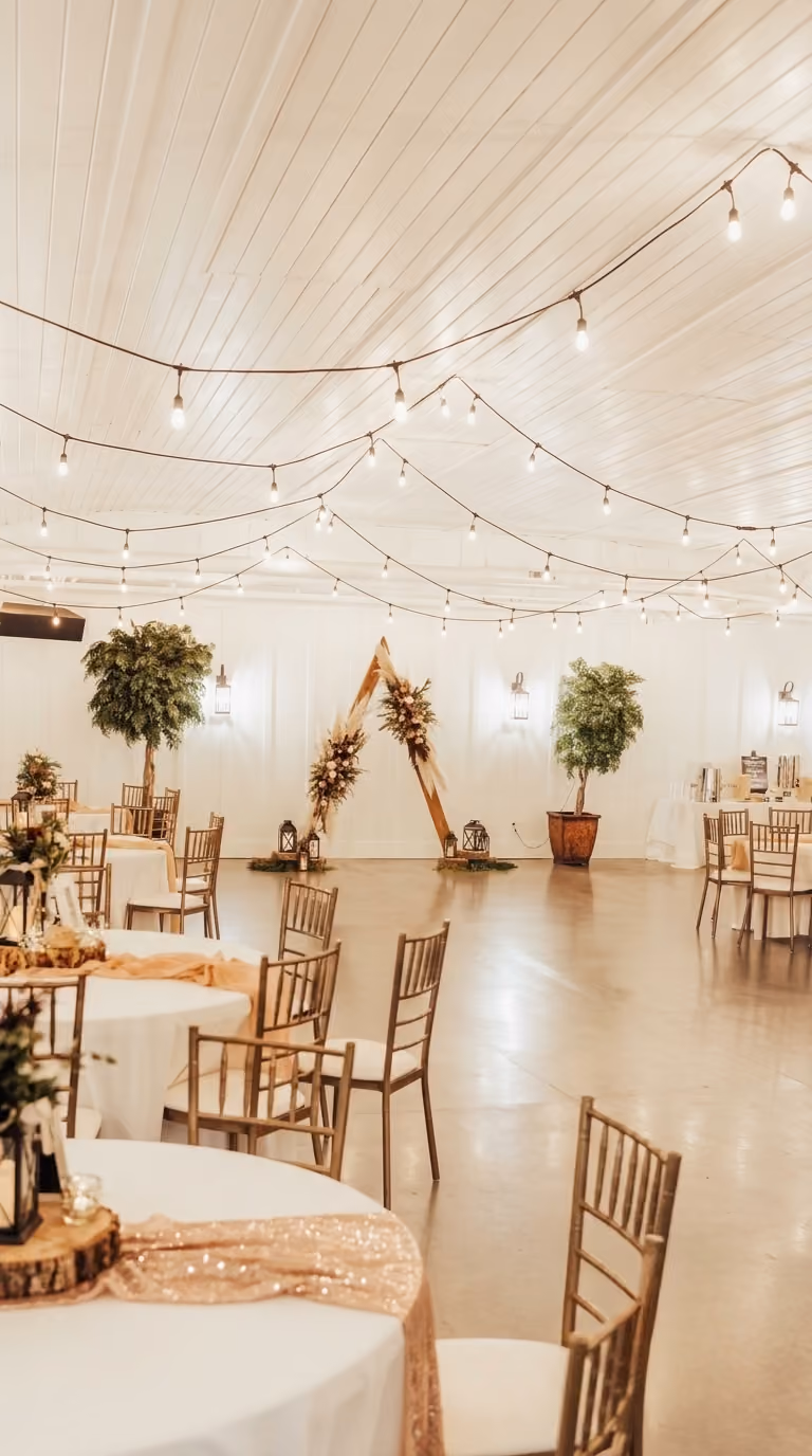 Wedding reception table setting with low floral centerpiece
