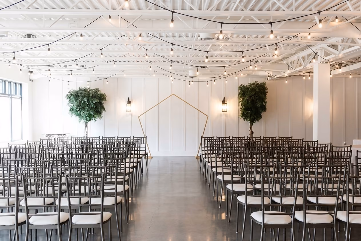 Elegant wedding reception with long rectangular tables, crystal candelabras, and floral centerpieces