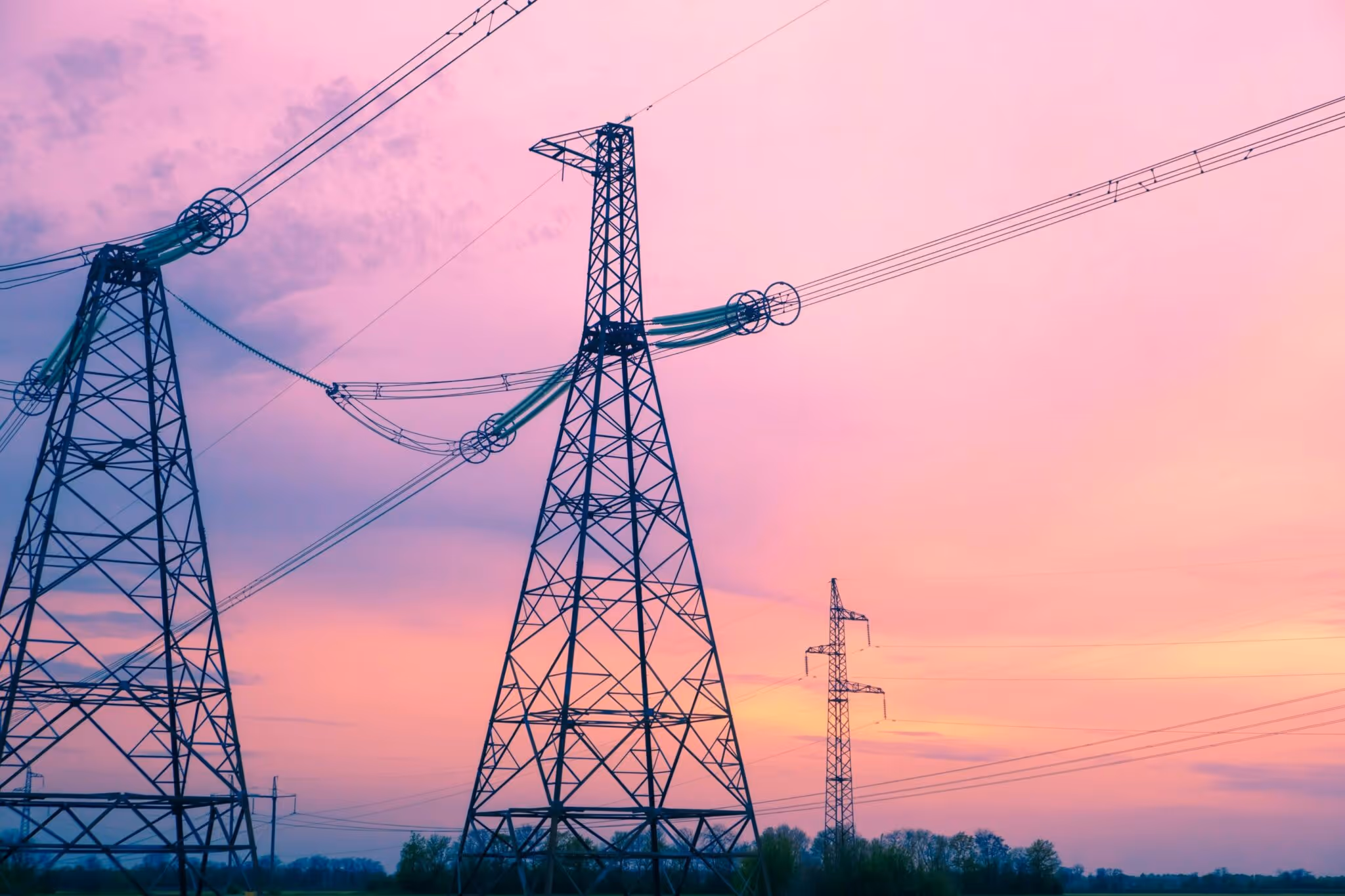 Power lines and electrical infrastructure at sunset
