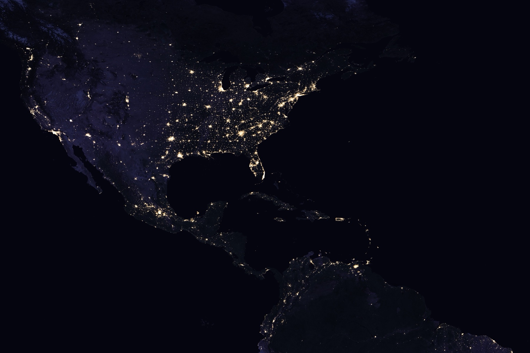 The Americas at night, lit by electricity