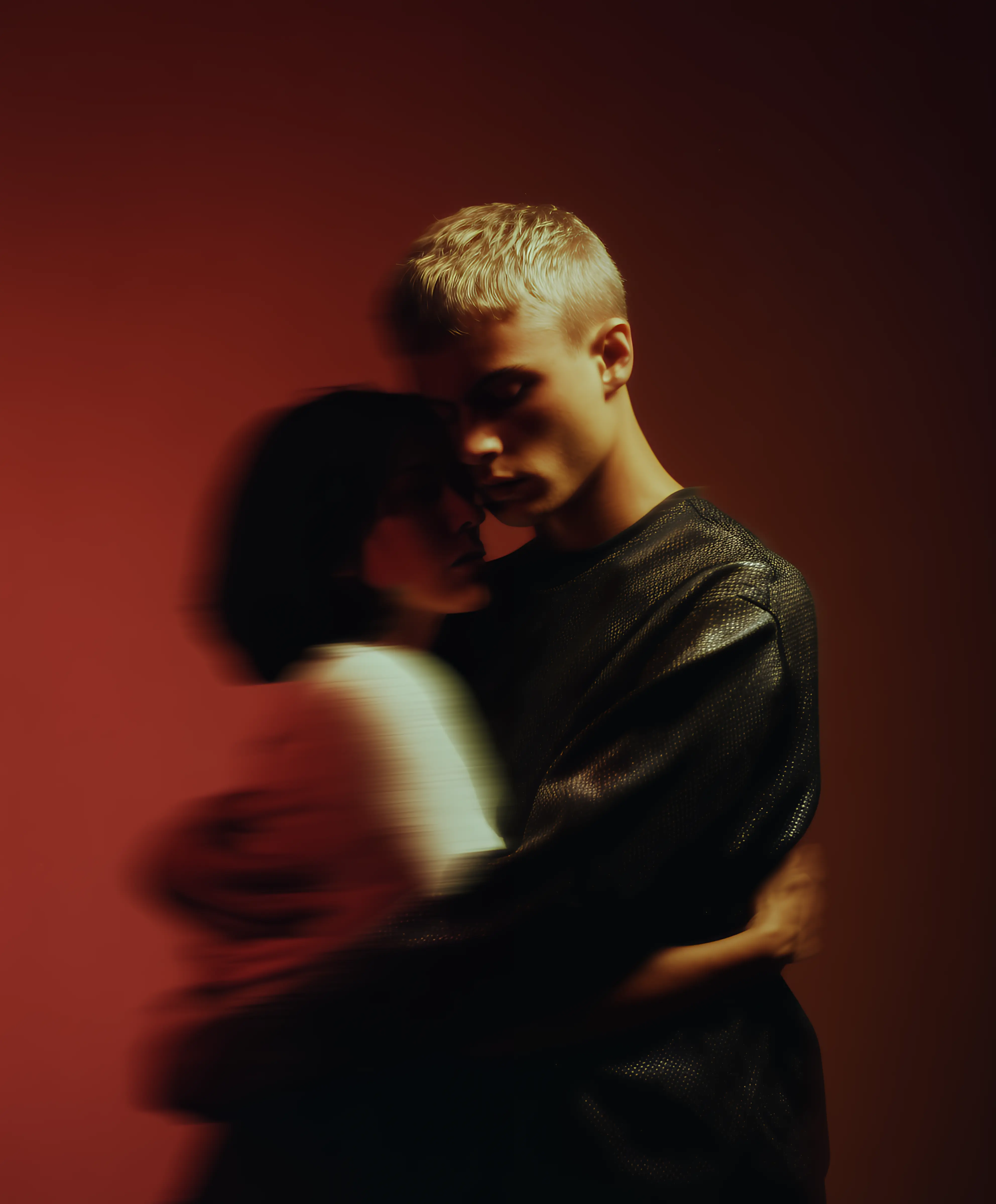 Blurry image of 2 people