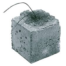 Precast concrete dobies for maintaining proper rebar coverage in slabs and footings.