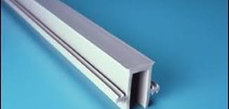 Plastic expansion joint cap to protect and cover exposed joint material at slab edges.