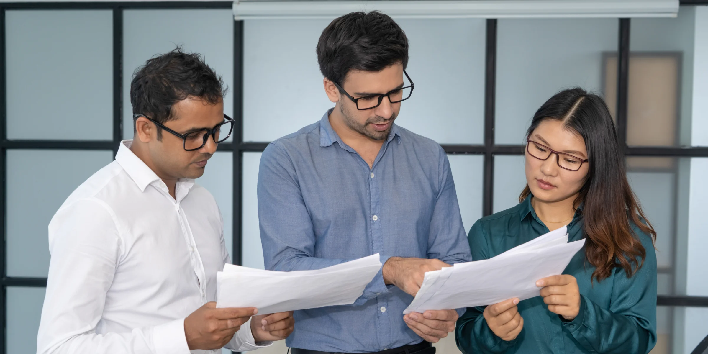 Business professional, comfortable with technology. Team discussion