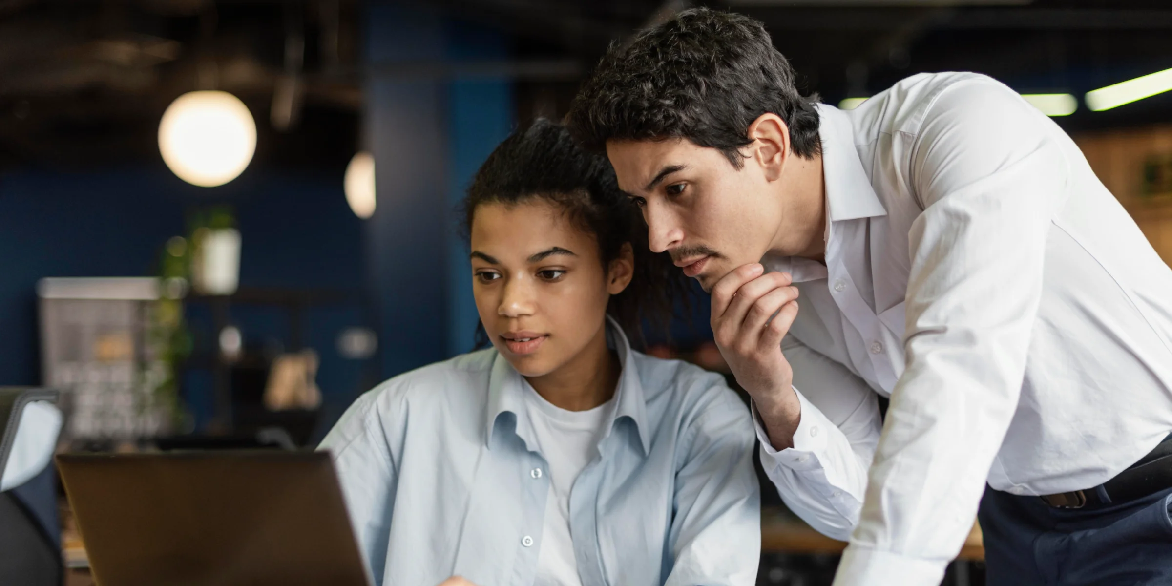 Business professional, comfortable with technology. Working on laptop