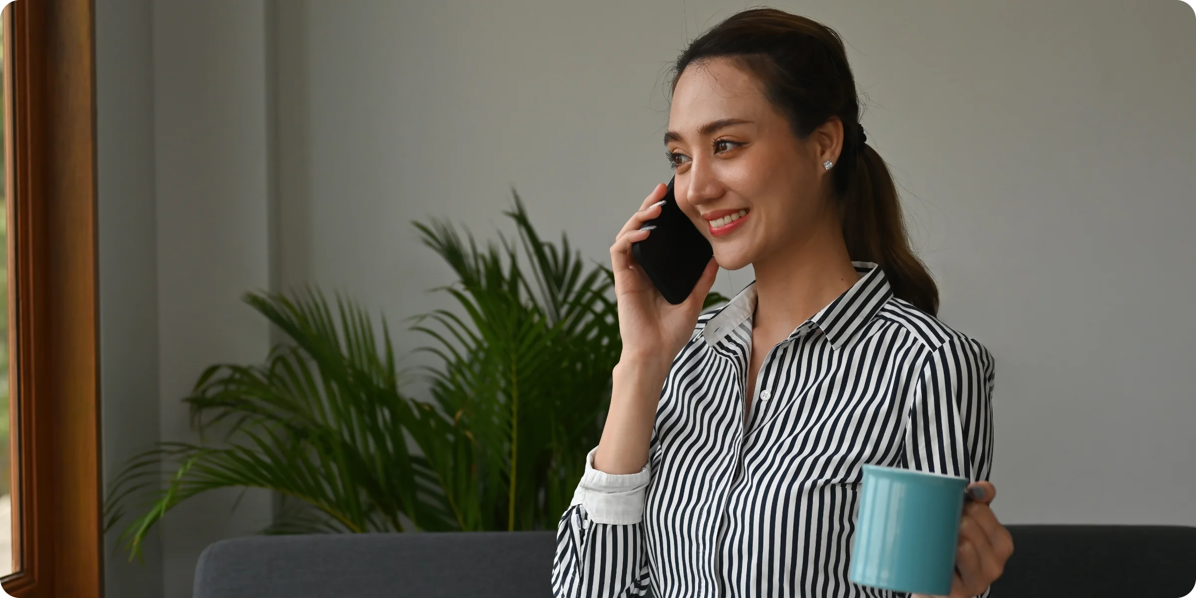 Business professional, comfortable with technology. Phone in hand