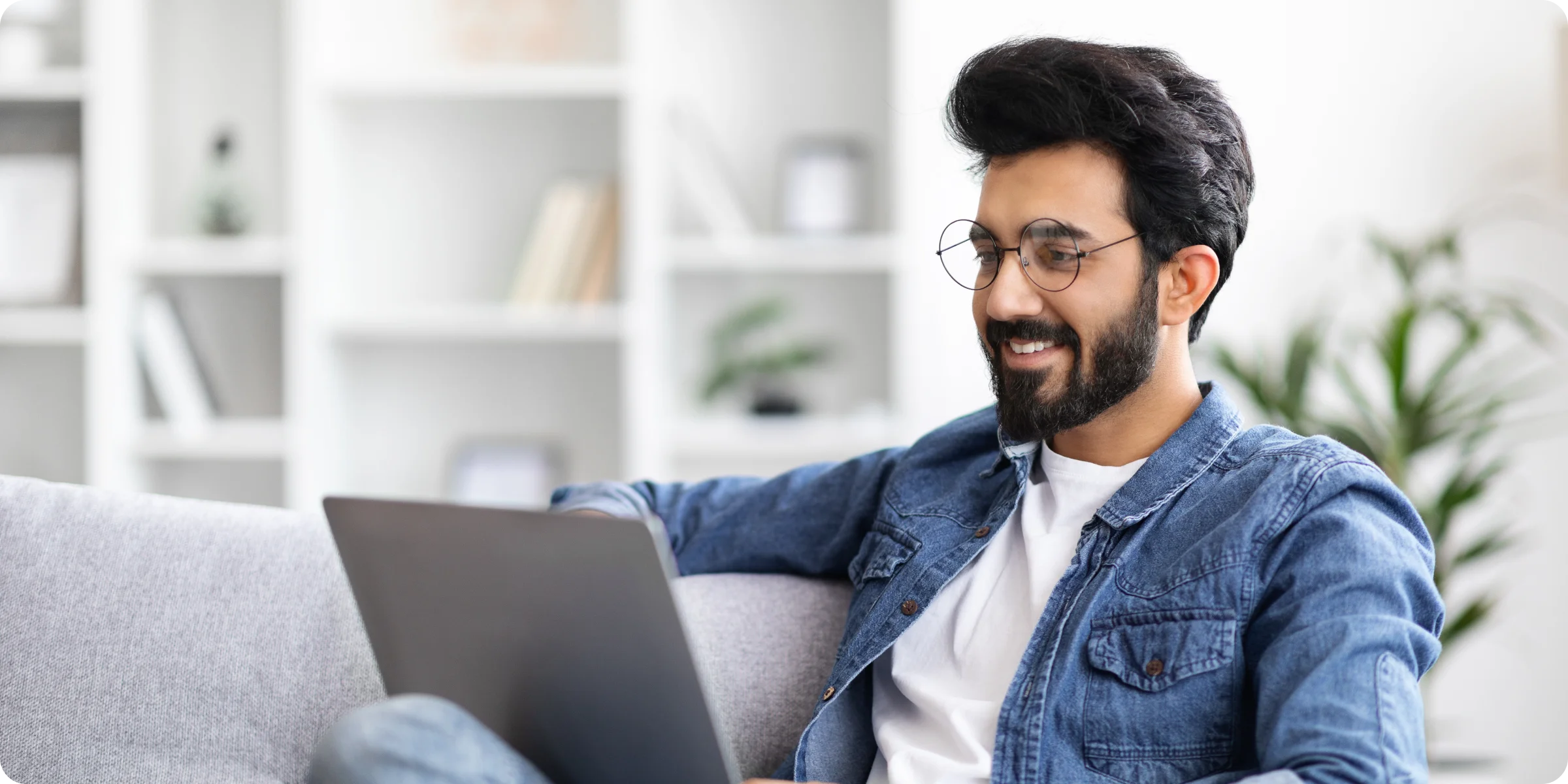 Business professional, comfortable with technology. Working on laptop