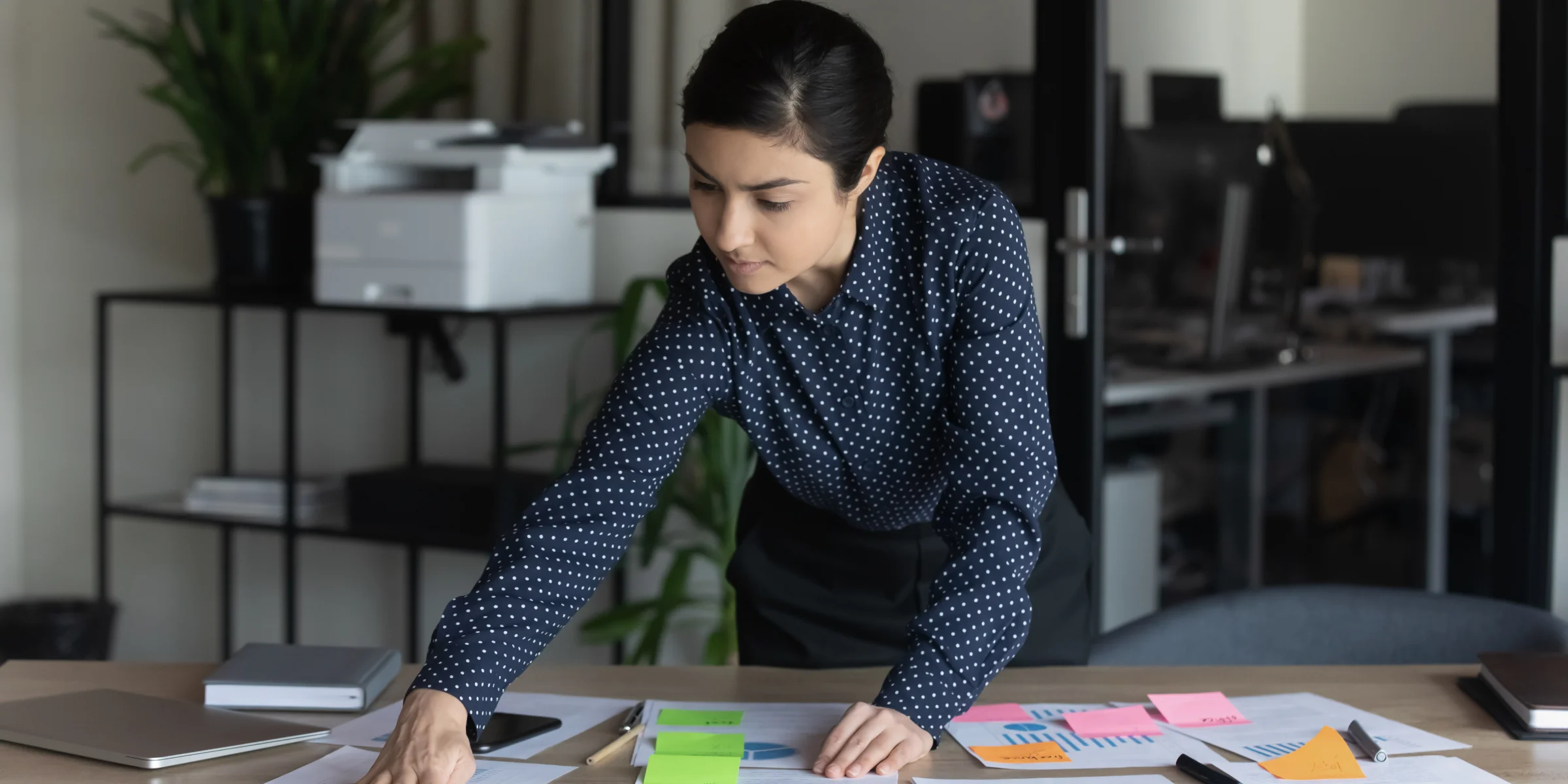 Business professional, comfortable with technology. Checking business reports.