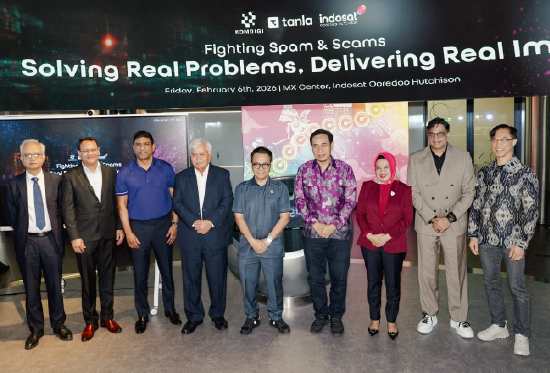 Business professionals comfortable with technology. Working on laptop.