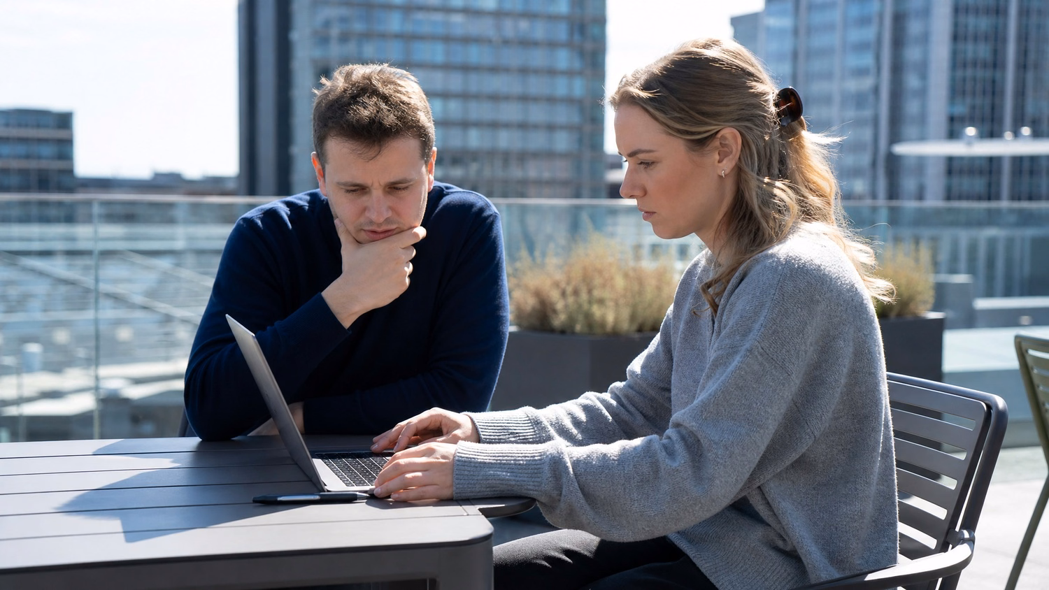 OUTDOOR TERRACE An IT professional one or two people working at a table on a