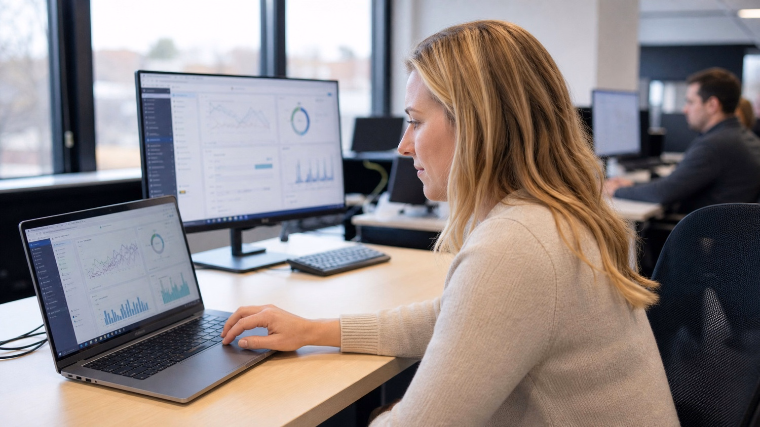 Woman analyzes complex data dashboard on laptop 54