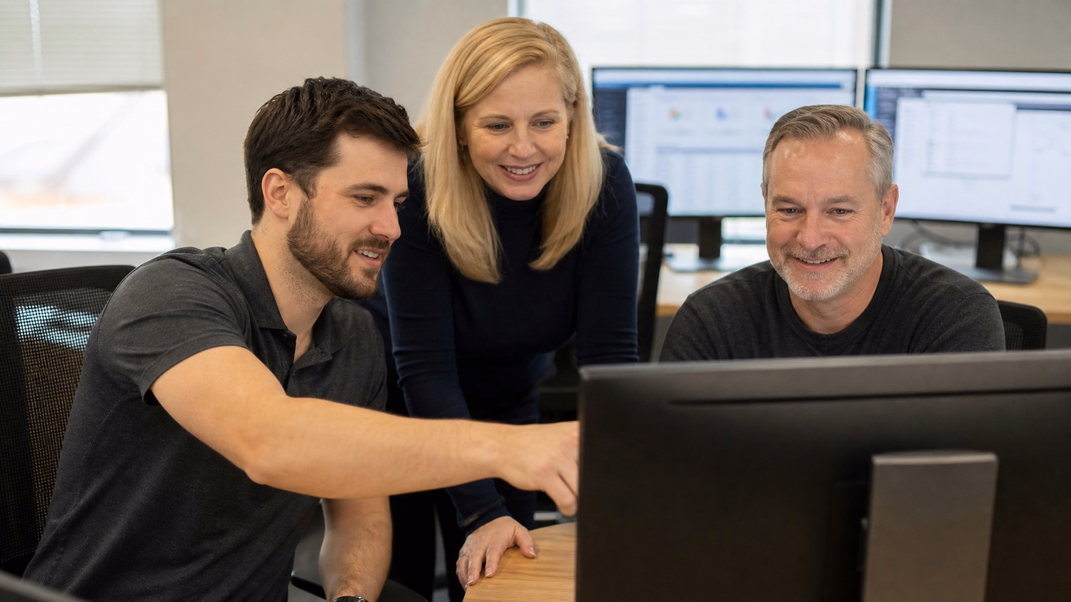 Team reviewing SSIS data flow on monitor screen 57 chars