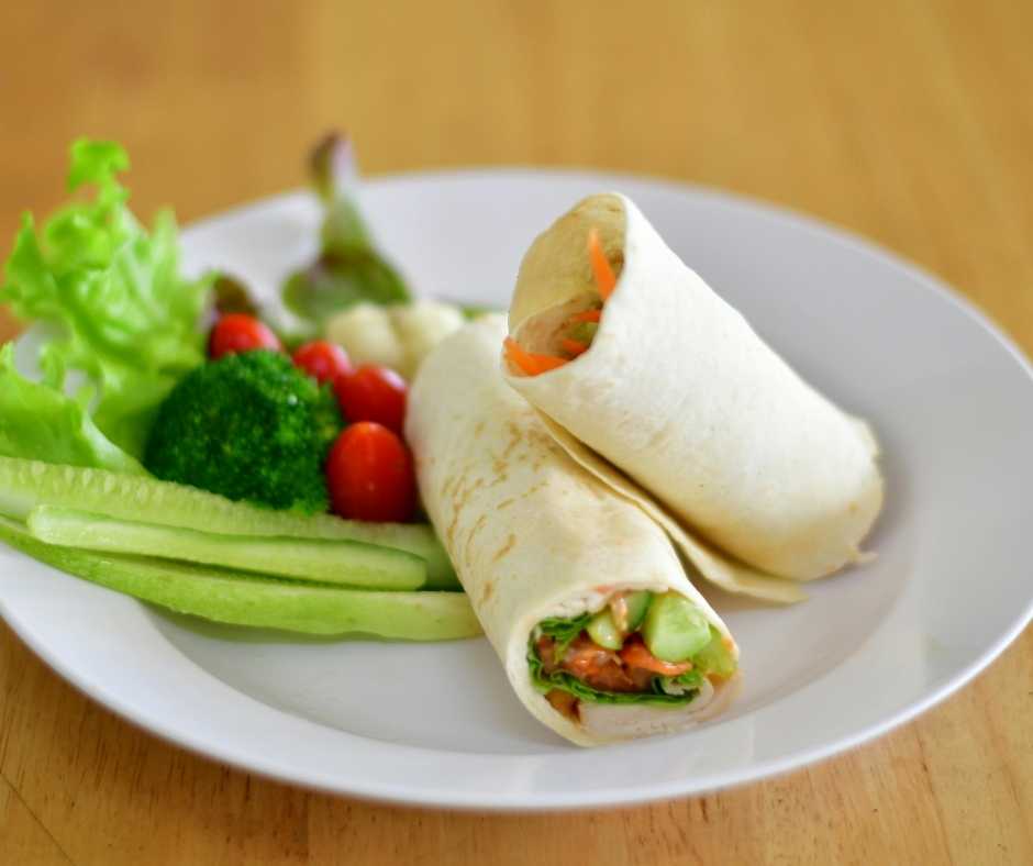 Healthy cucumber & hummus wrap recipe prepared as part of the SheMed UK nutrition plan.