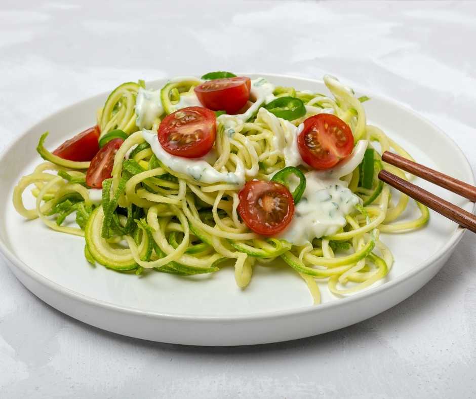 Healthy zucchini noodles with pesto recipe prepared as part of the SheMed UK nutrition plan.