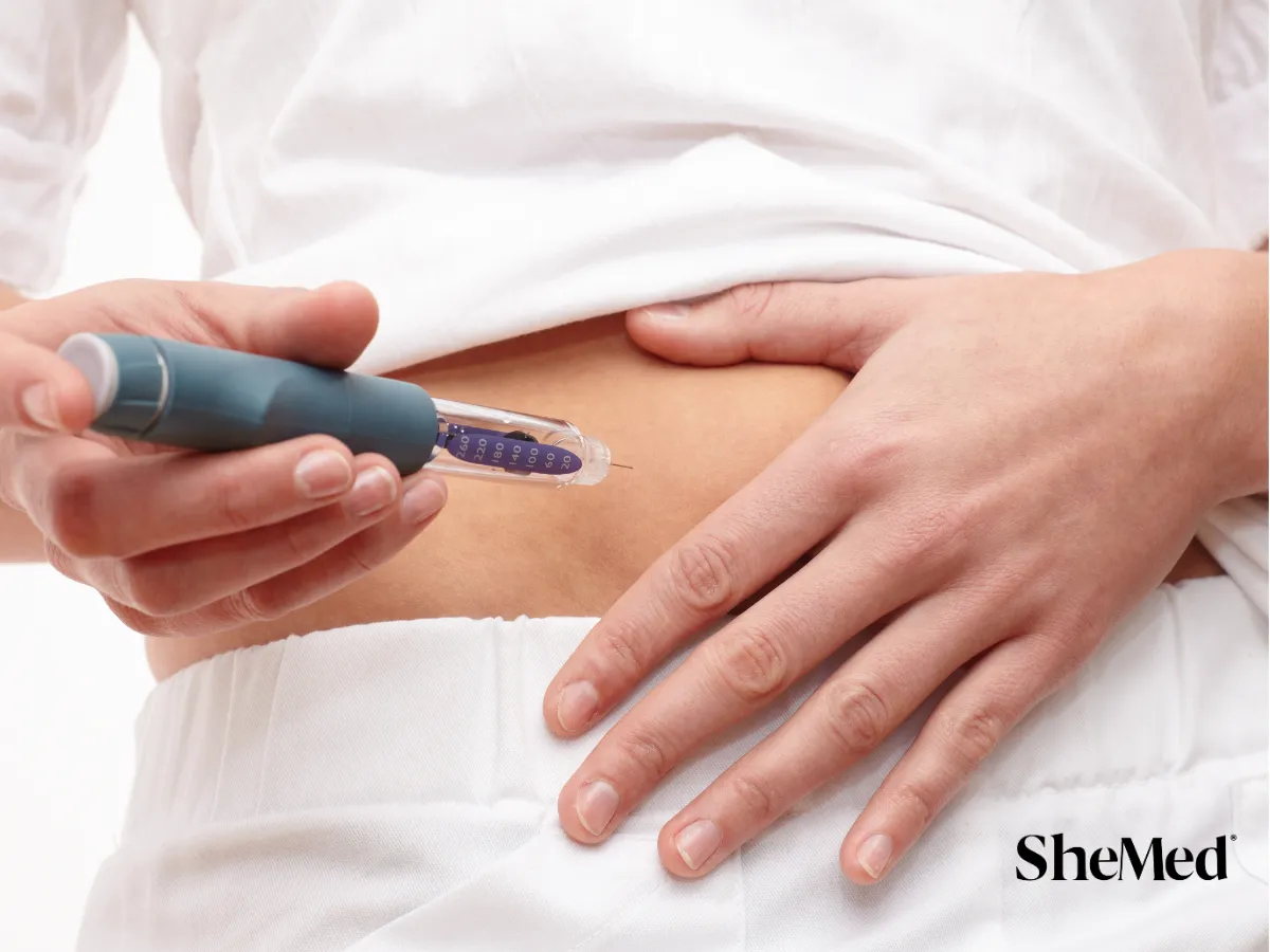 A women giving herself an injection.