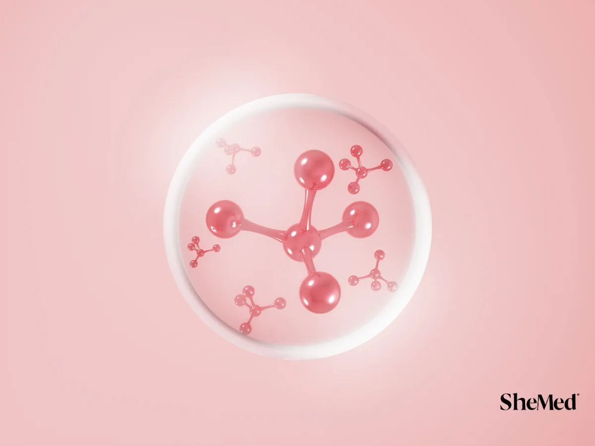 3D illustration of pink molecular structures inside a transparent cell bubble on a soft pink background.