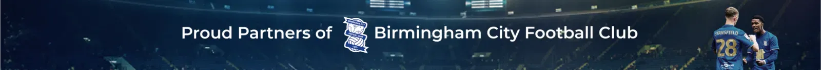 Banner showing text 'Proud Partners of Birmingham City Football Club' with the club crest and two football players celebrating on the right.