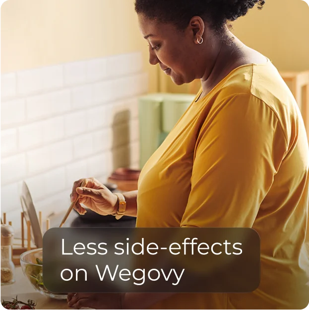 Woman in a yellow shirt mixing ingredients in a bowl in a kitchen with text that reads 'Less side-effects on Wegovy.'