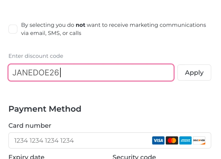 Checkout form showing an unchecked marketing consent box, a discount code field with JANEDOE26 entered, and a payment method section requesting card number with credit card logos.