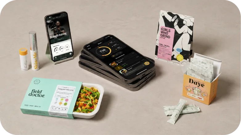Various health bars and vegan protein blend packages arranged on a light background.