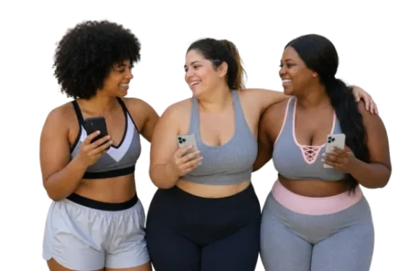 Group of three women smiling together with phones.
