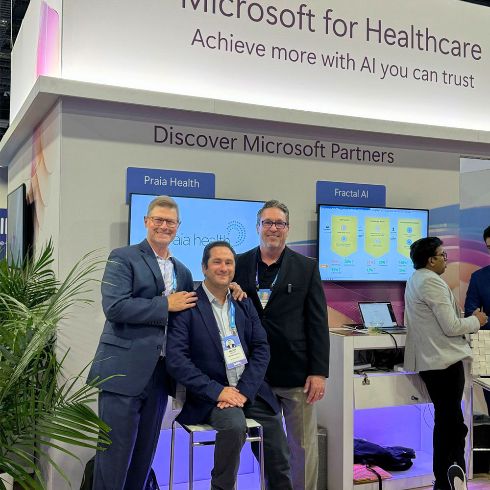 Praia team members at a conference