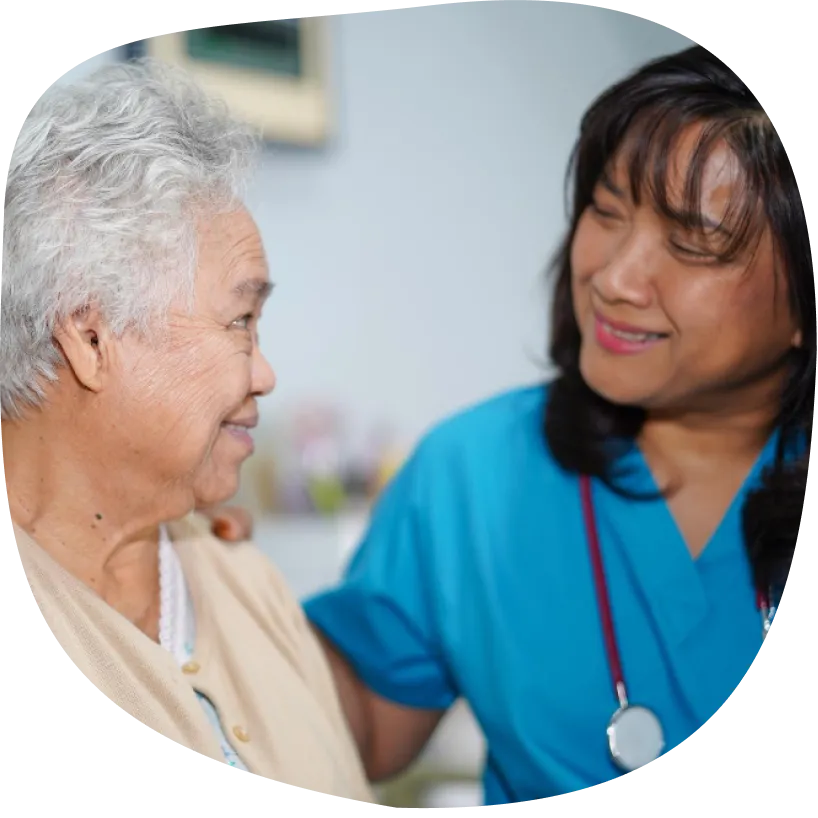 Healthcare professional talking with an older woman