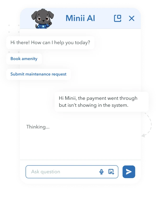 Woman reviewing papers at desk with laptop, documents, and a chatbot window showing overdue payment reminders.