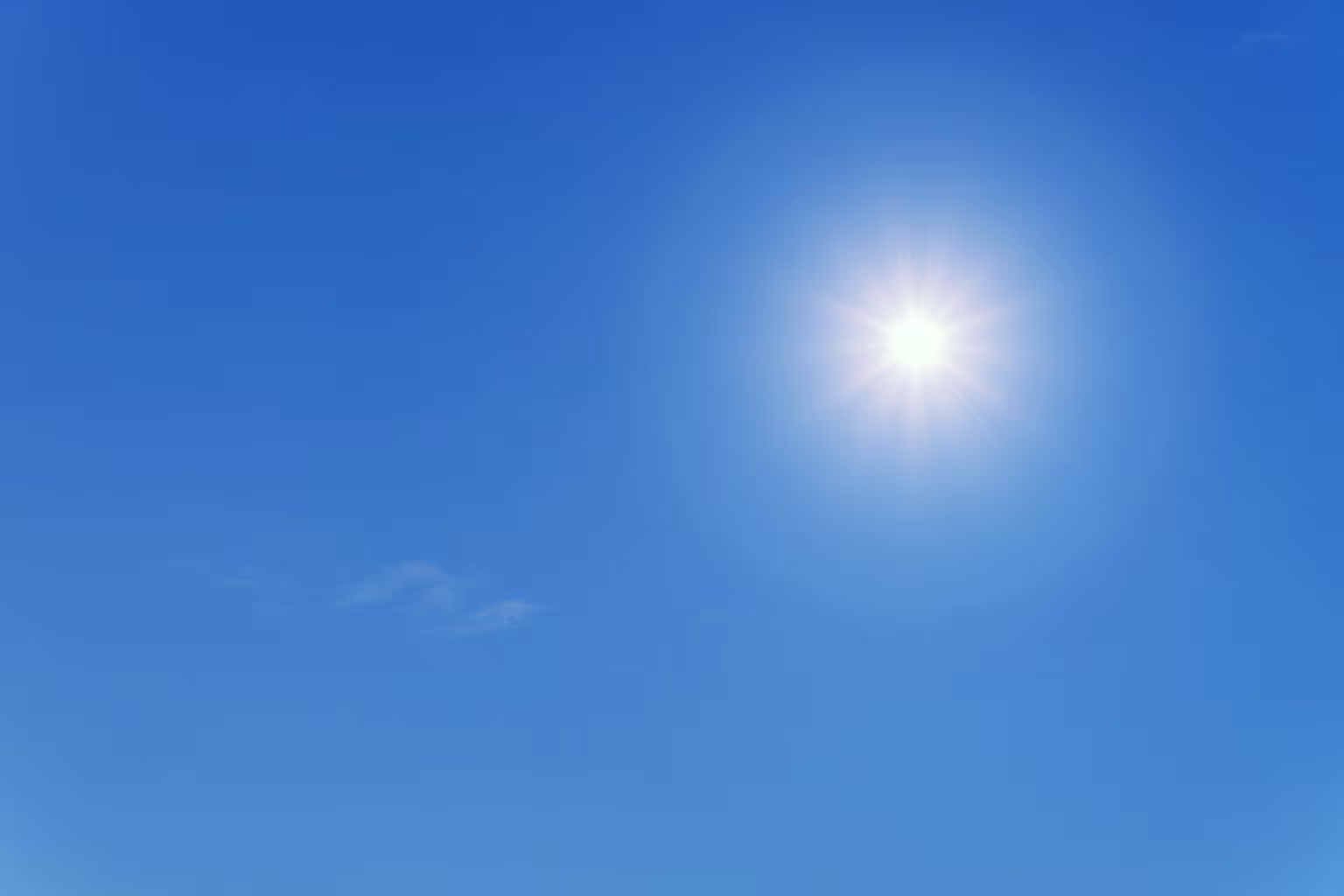 Heldere blauwe lucht met stralende zon en enkele witte wolken, als symbool voor frisse lucht en gezonde longen.