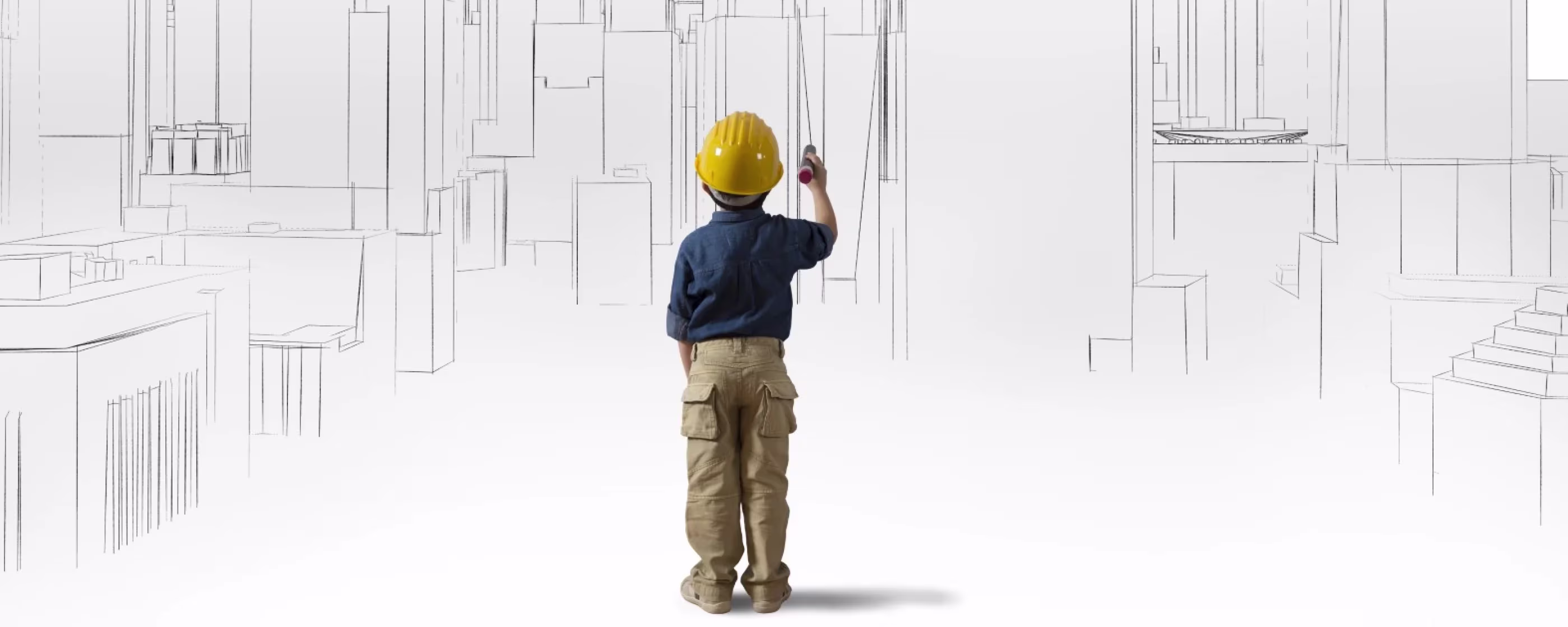 Een kind met gele helm tekent architecturale lijnen op een witte muur, symboliserend toekomstgericht bouwen en ontwikkeling.