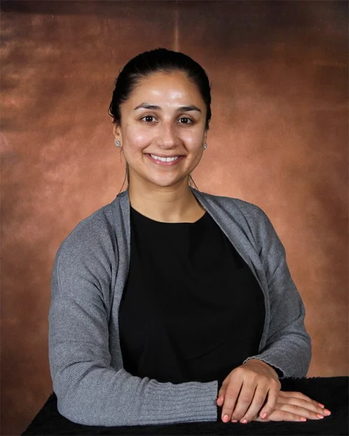 Ms Dimas smiling in professional staff portrait photo