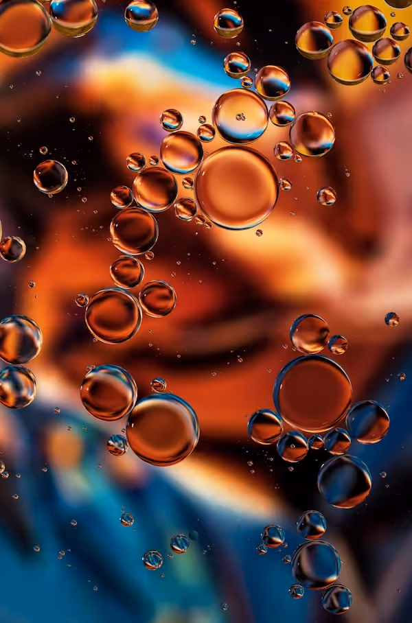 "Copper Glow". Oil drops on water. The background is an A3 photocopy of one of Unsplash photographer Vinicius Amano's fantastic photos. Please see the tutorial on the page "Oil and water photography" on my site Tracts4free.WordPress.com.