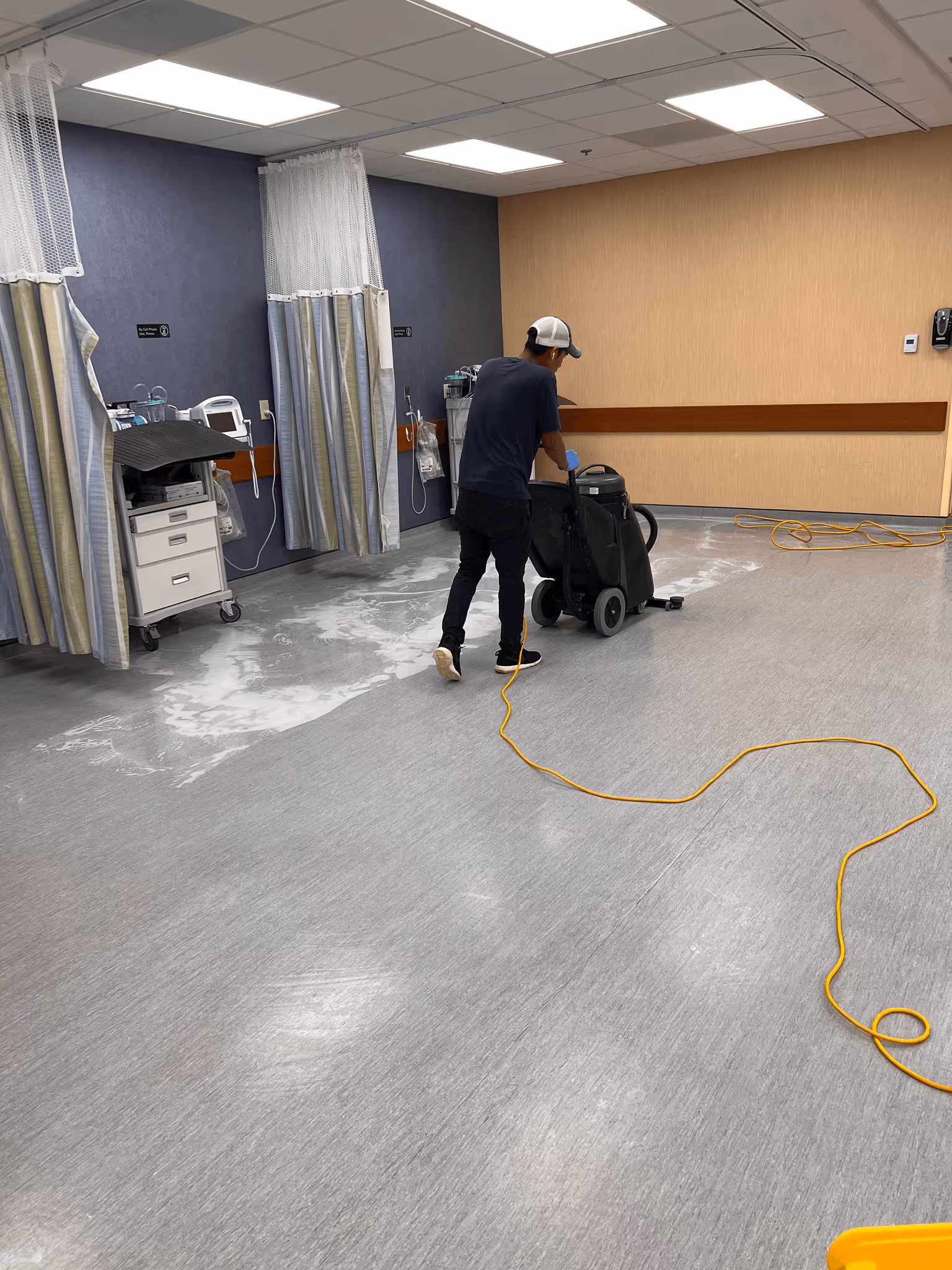 A man cleaning a floor