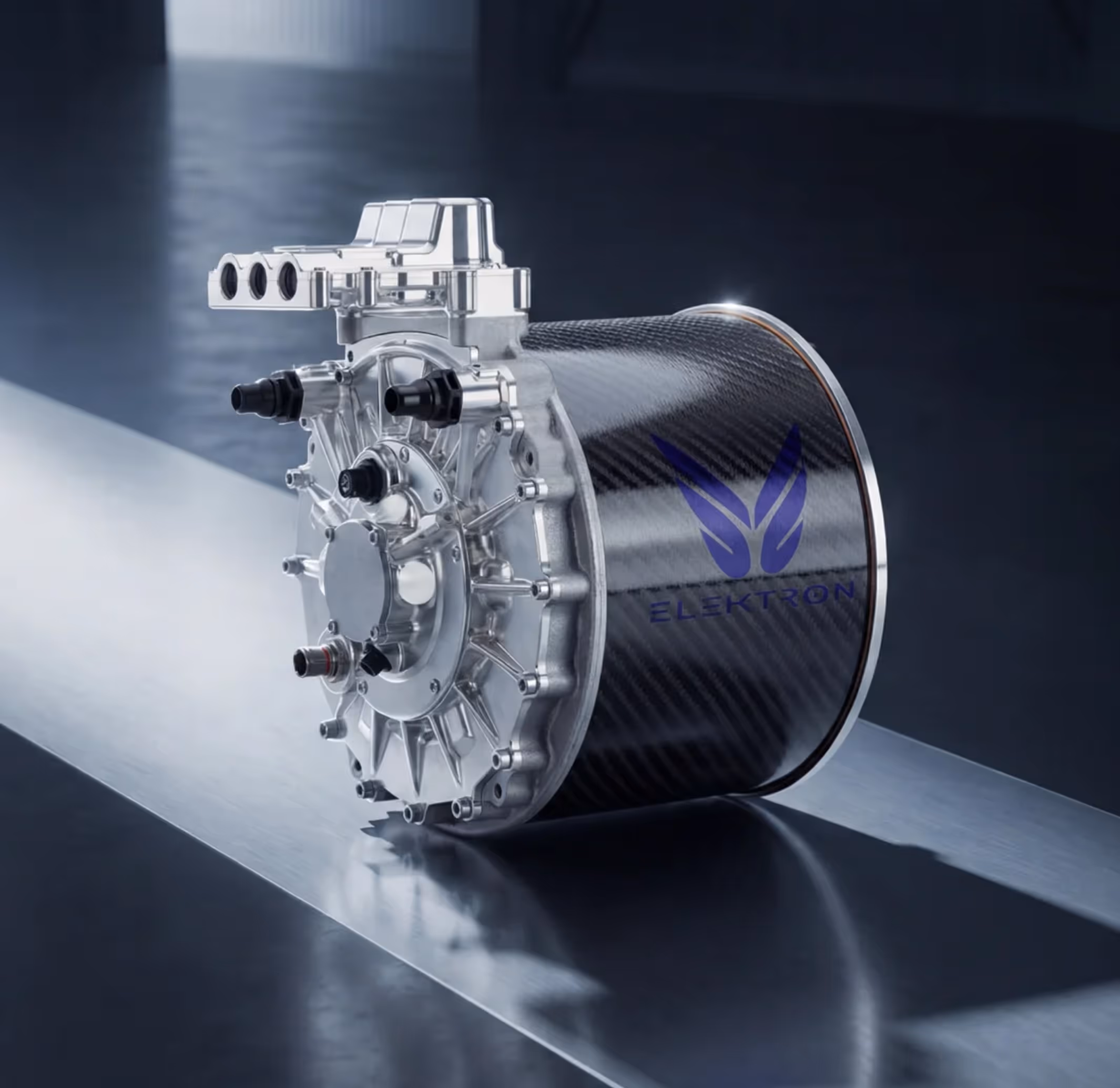 Silver and carbon fiber electric motor with connectors and the logo 'ELEKTRON' on a reflective surface.